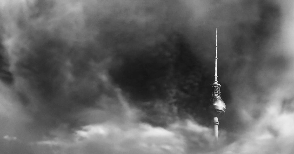 Black and white image of a futuristic tower reaching into the sky