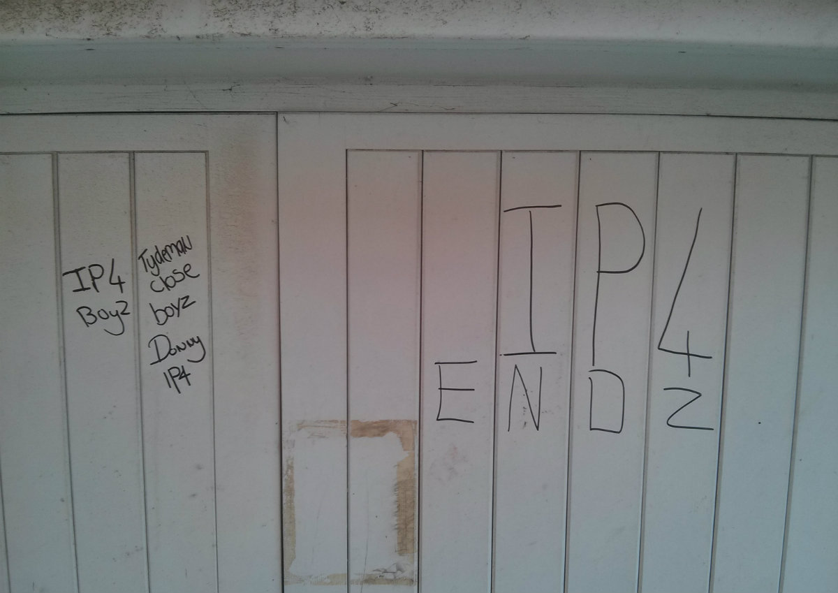 Garage door with 'IP4 ENDZ' grafitti